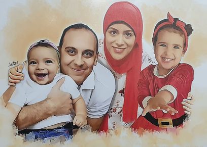 الشهيد محمد شلبي وأرملته وطفلتيه