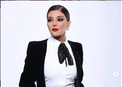 الديفا سميرة سعيد بالبدلة الرجالي