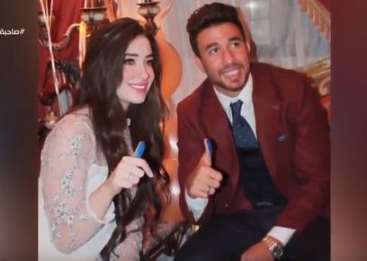 محمود تريزيجيه وزوجته
