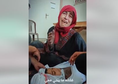 فلسطينية تتوسل بتكفينها مع طفلها بعد استشهاده