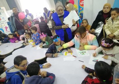 ركن للألعاب وورش حكي وتلوين ورسم داخل جناح الطفل بمعرض الكتاب