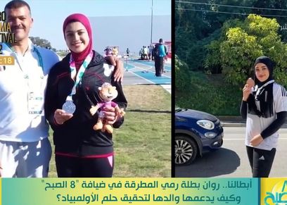 البطلة روان أيمن ومدربها أيمن بركات