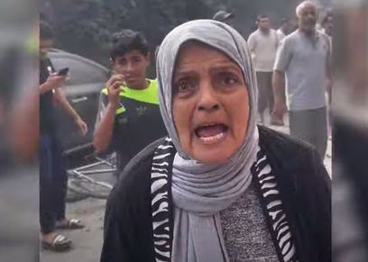 سيدة عجوز تصرخ لإغاثة غزة