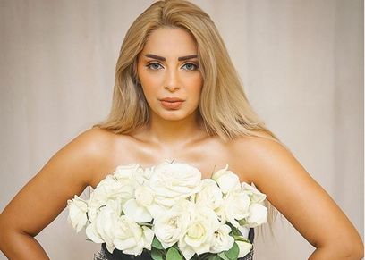 المذيعة مي حلمي في جلسة التصوير