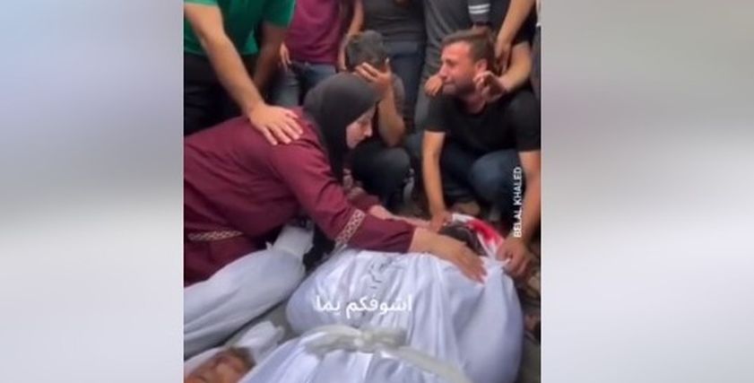 أم فلسطينية تبكي أبنائها وتحتضن جثثهم
